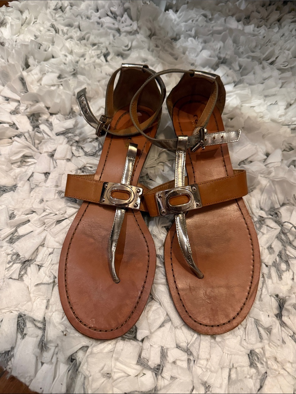 Coach
Women’s Brown Leather T-Strap Sandals with Metallic Accents